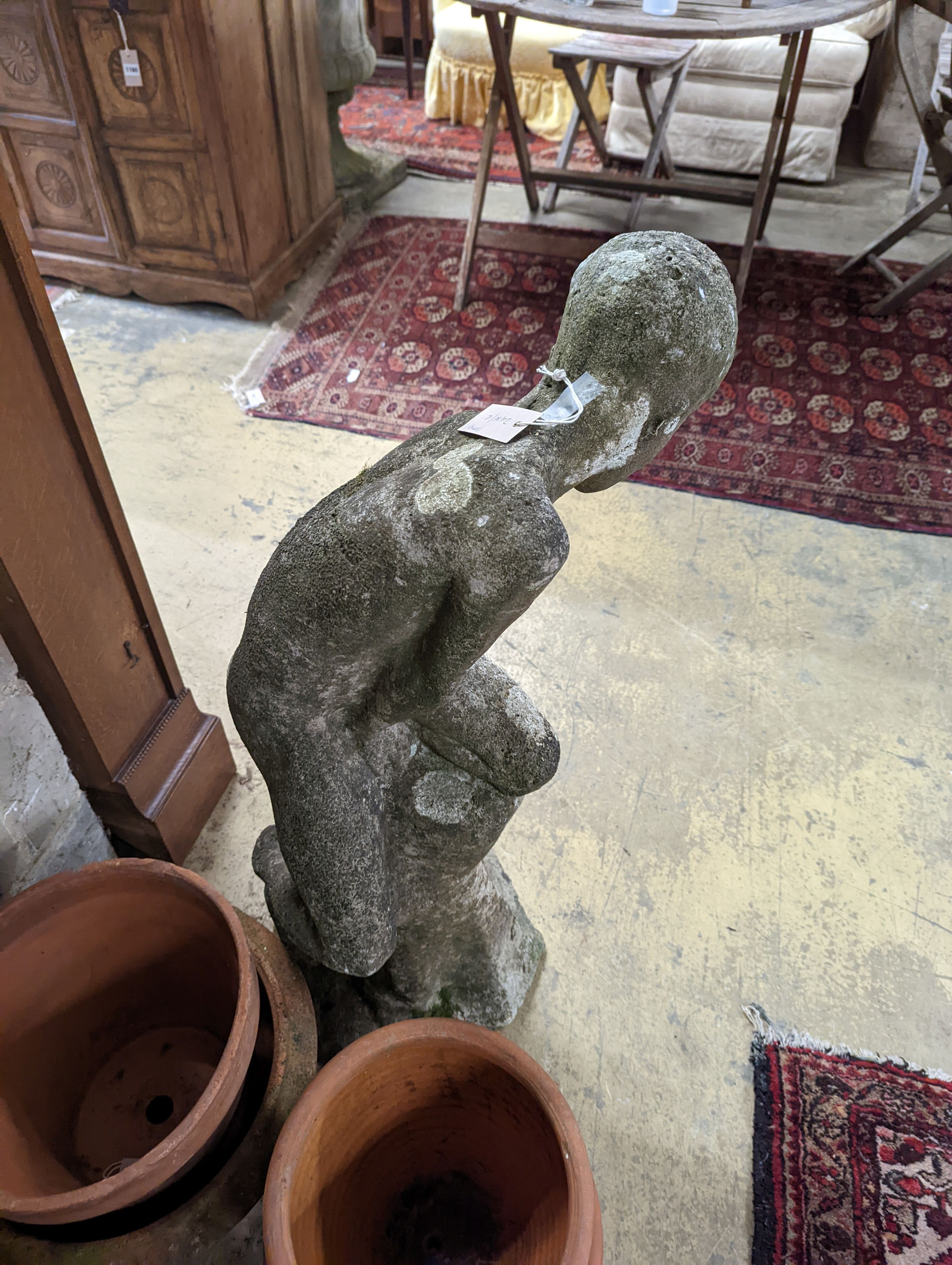 A reconstituted stone garden ornament, child bather, height 94cm